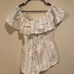Worn once romper, cream and black size medium